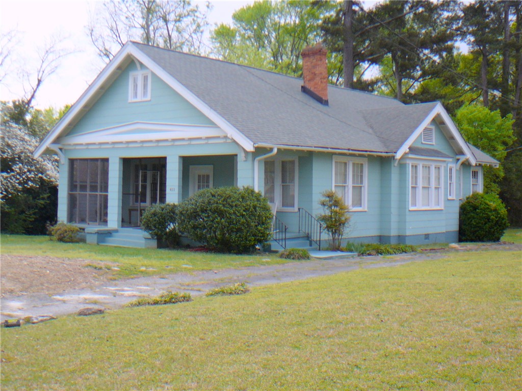 411 Central Avenue Anderson, SC 29625 - Photo 2 of 23 This charming residence features a well-maintained exterior and inviting front porch.
