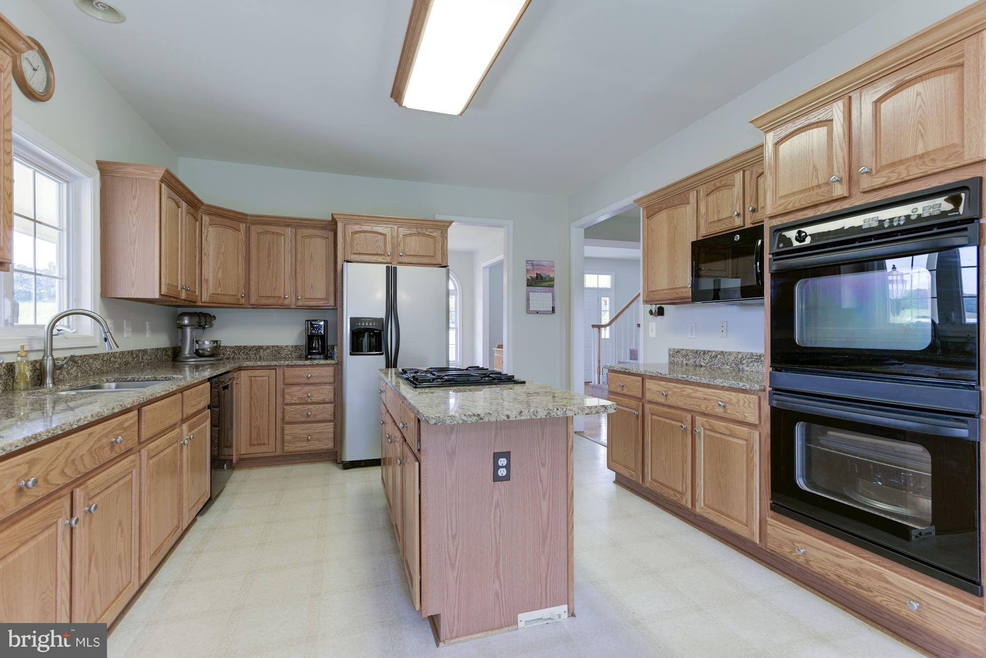 43661 Spinks Ferry Road Leesburg, VA 20176 - Photo 11 of 30 Kitchen with Gas Cooktop in Center Island