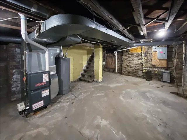 a view of empty room with wooden walls