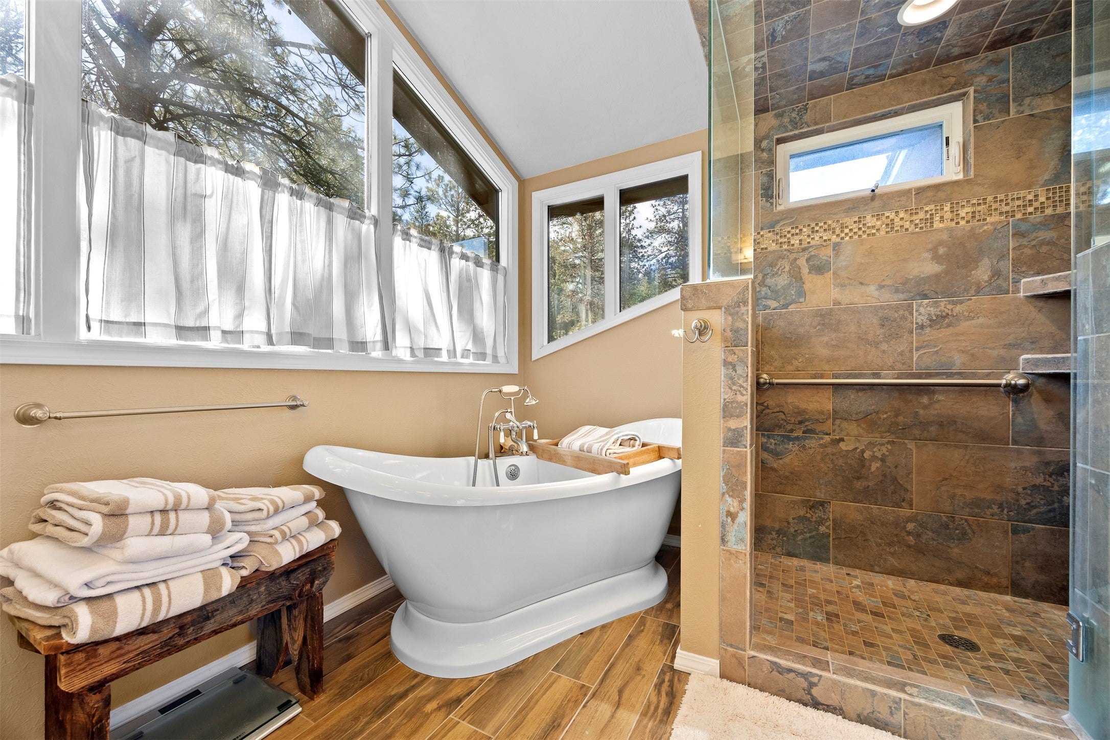730 Big Flat Road Missoula, MT 59804 - Photo 47 of 59 Full bathroom with tiled shower, a freestanding bath, and wood finish floors