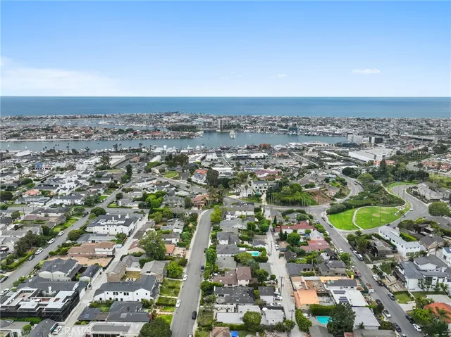 an aerial view of residential building and car parked