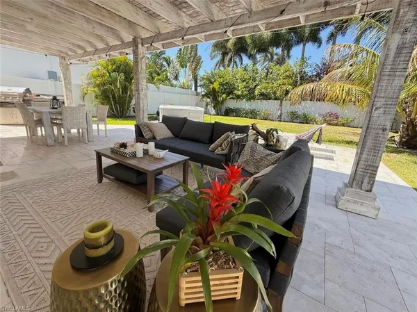 a view of a chairs and table in a patio