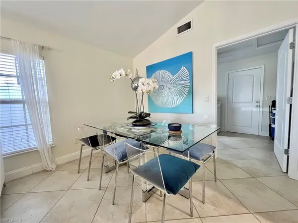 a room with table and chairs