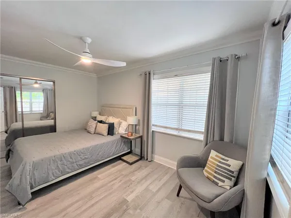 a bedroom with a bed and a couch