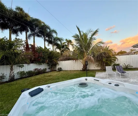 a view of backyard of a house and trees
