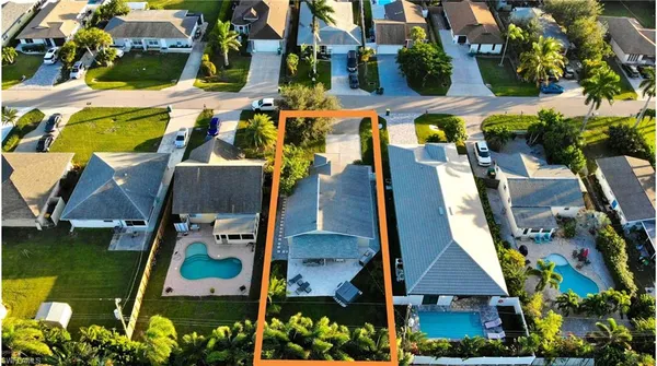 an aerial view of houses with outdoor space