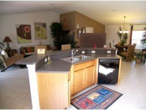 1010 Northeast Morgan Palm Bay, FL 32905 - Photo 5 of 12 a view of living room with granite countertop furniture and a couch