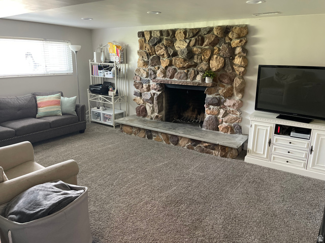 2444 Quail Run Drive Sandy, UT 84093 - Photo 10 of 23 Lower level family room- natural light, stone fireplace