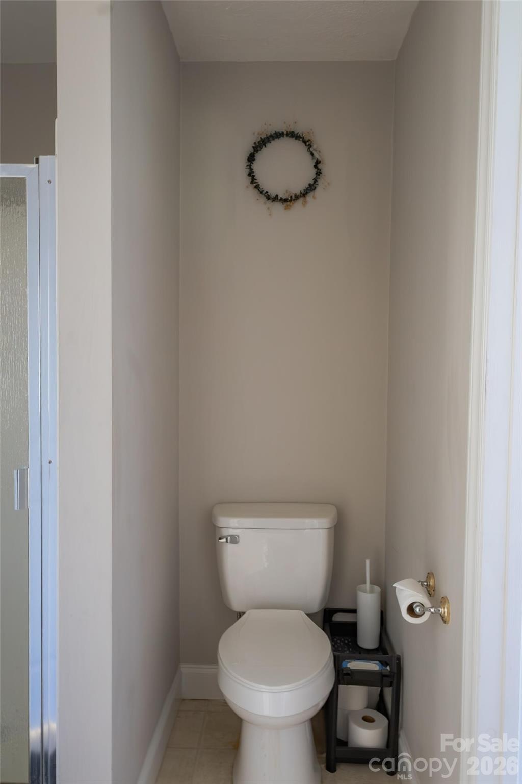3780 Cook Road Valdese, NC 28690 - Photo 32 of 47 a white toilet sitting next to a shower