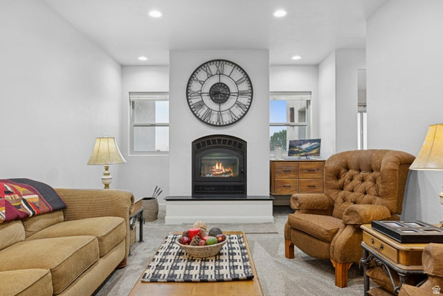 2925 Juniper Road Enterprise, UT 84725 - Photo 12 of 56 Living area with a warm lit fireplace and recessed lighting