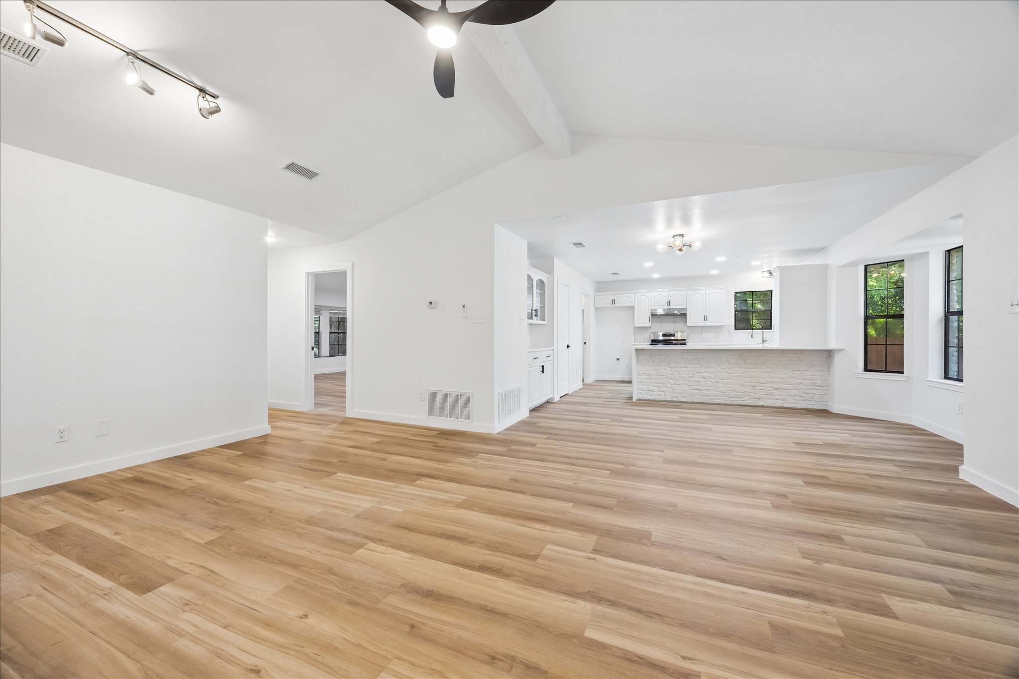 1706 Davis Street Taylor, TX 76574 - Photo 4 of 18 A streamlined kitchen layout blends seamlessly with a bright, spacious living area, ideal for modern living.