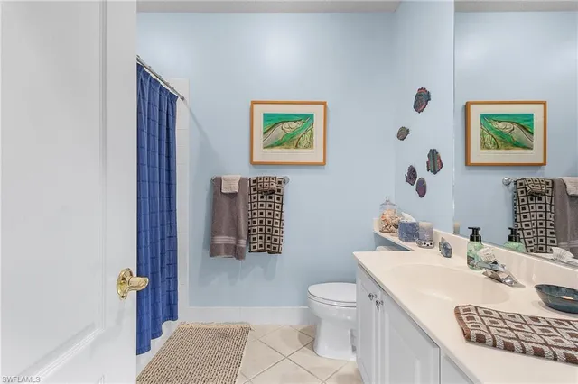 a bathroom with a sink a mirror and a toilet