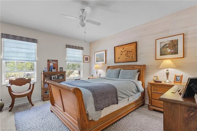 a bed room with a bed and a chair