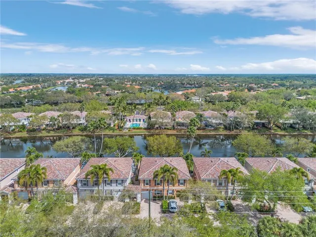 aerial view of a house with a lake view