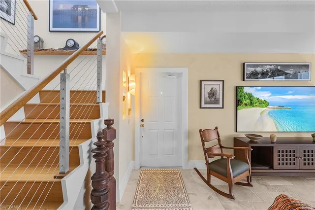 a living room with furniture and a rug