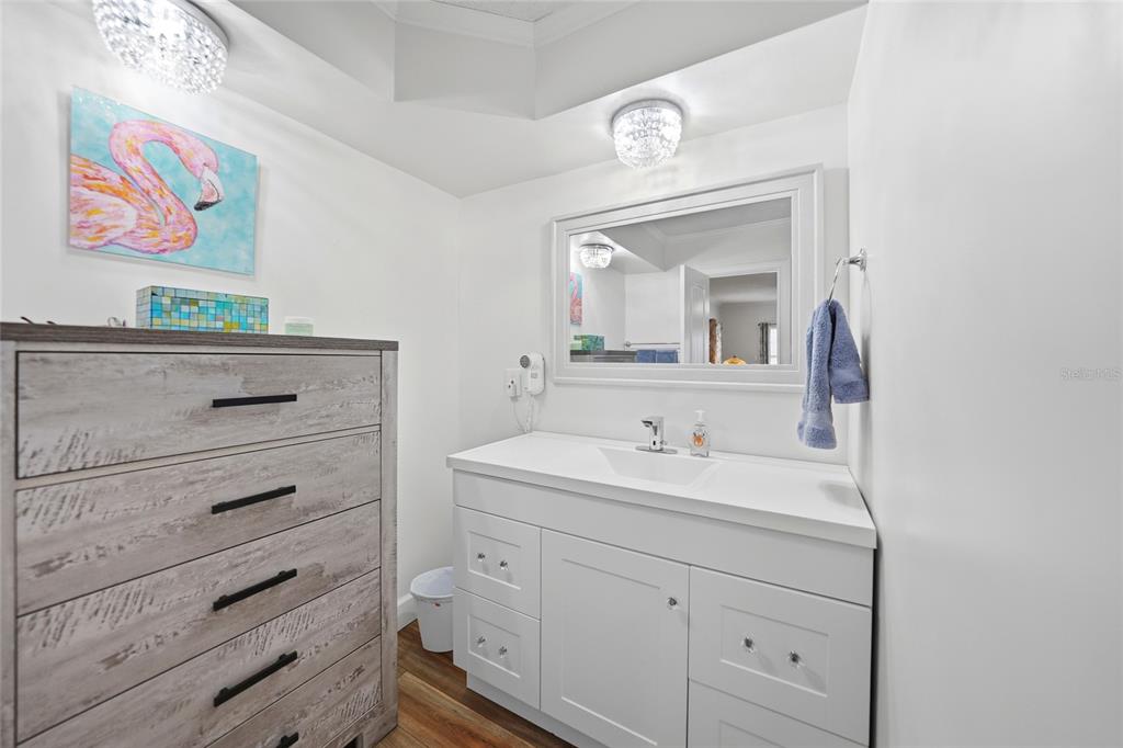 10303 Burnt Store Road, Unit 143 Punta Gorda, FL 33950 - Photo 15 of 42 a bathroom with a sink mirror and vanity
