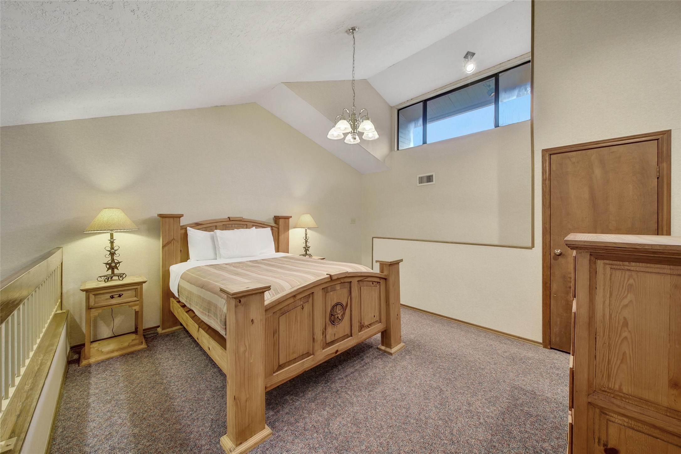 1000 April Sound Boulevard Conroe, TX 77356 - Photo 33 of 46 a bedroom with a bed and a night stand