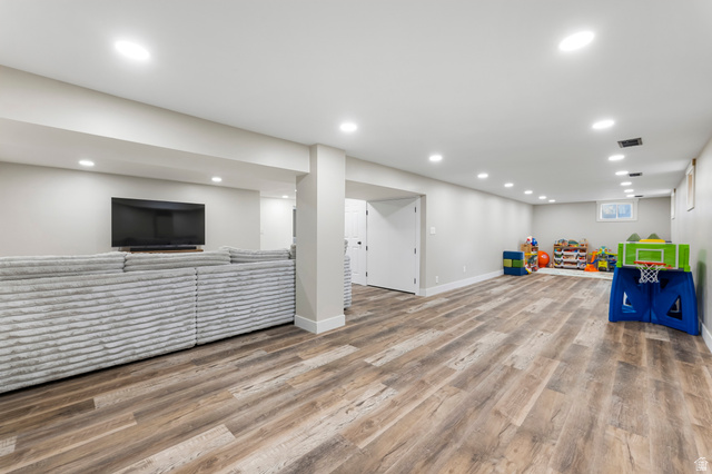 523 South Main Street Payson, UT 84651 - Photo 30 of 41 Spacious lower-level area featuring recessed lighting, wood-finish flooring, light gray walls, and white trim