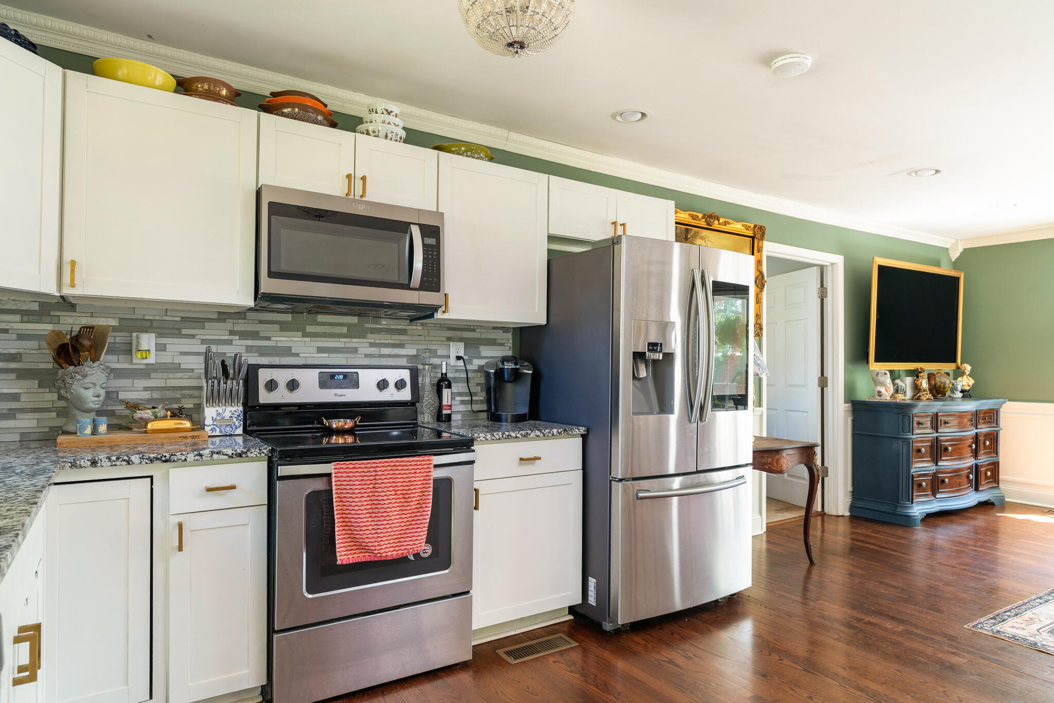 912 Barnabas Street Athens, TN 37303 - Photo 10 of 32 a kitchen with stainless steel appliances a stove microwave and a refrigerator