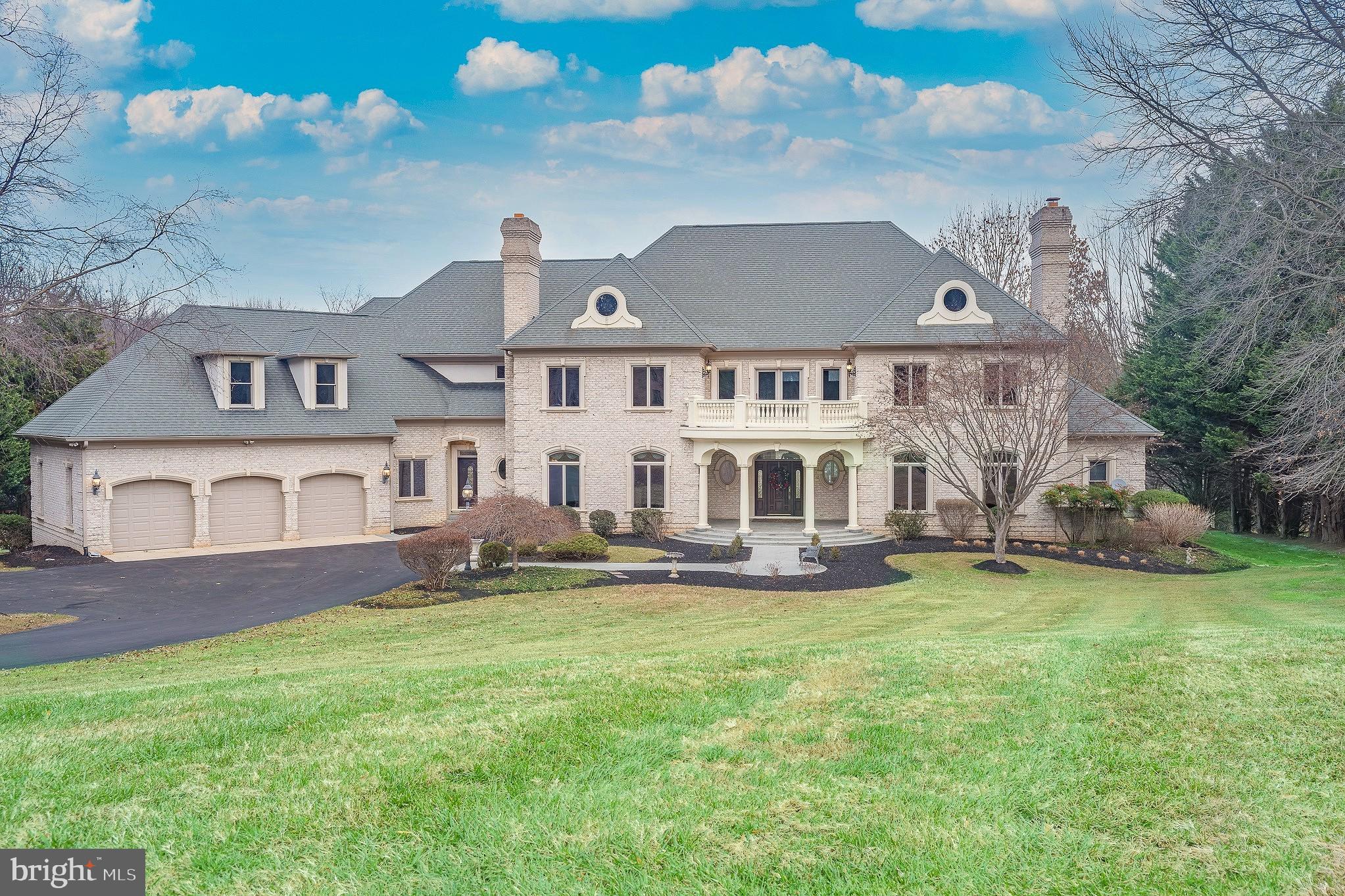 a view of a house with a garden and yard