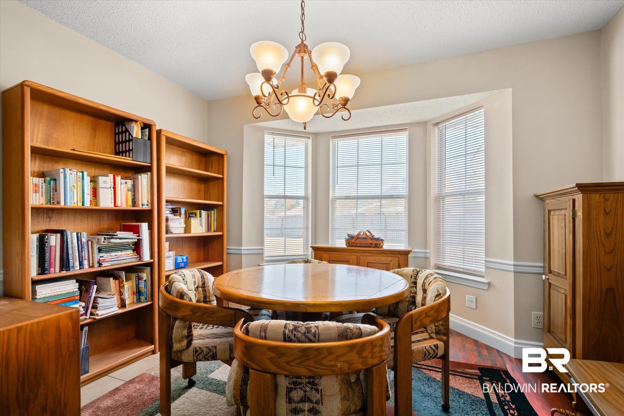 8374 Kipling Court Mobile, AL 36695 - Photo 8 of 20 Dining room with a chandelier, light hardwood / wood-style flooring, and a textured ceiling