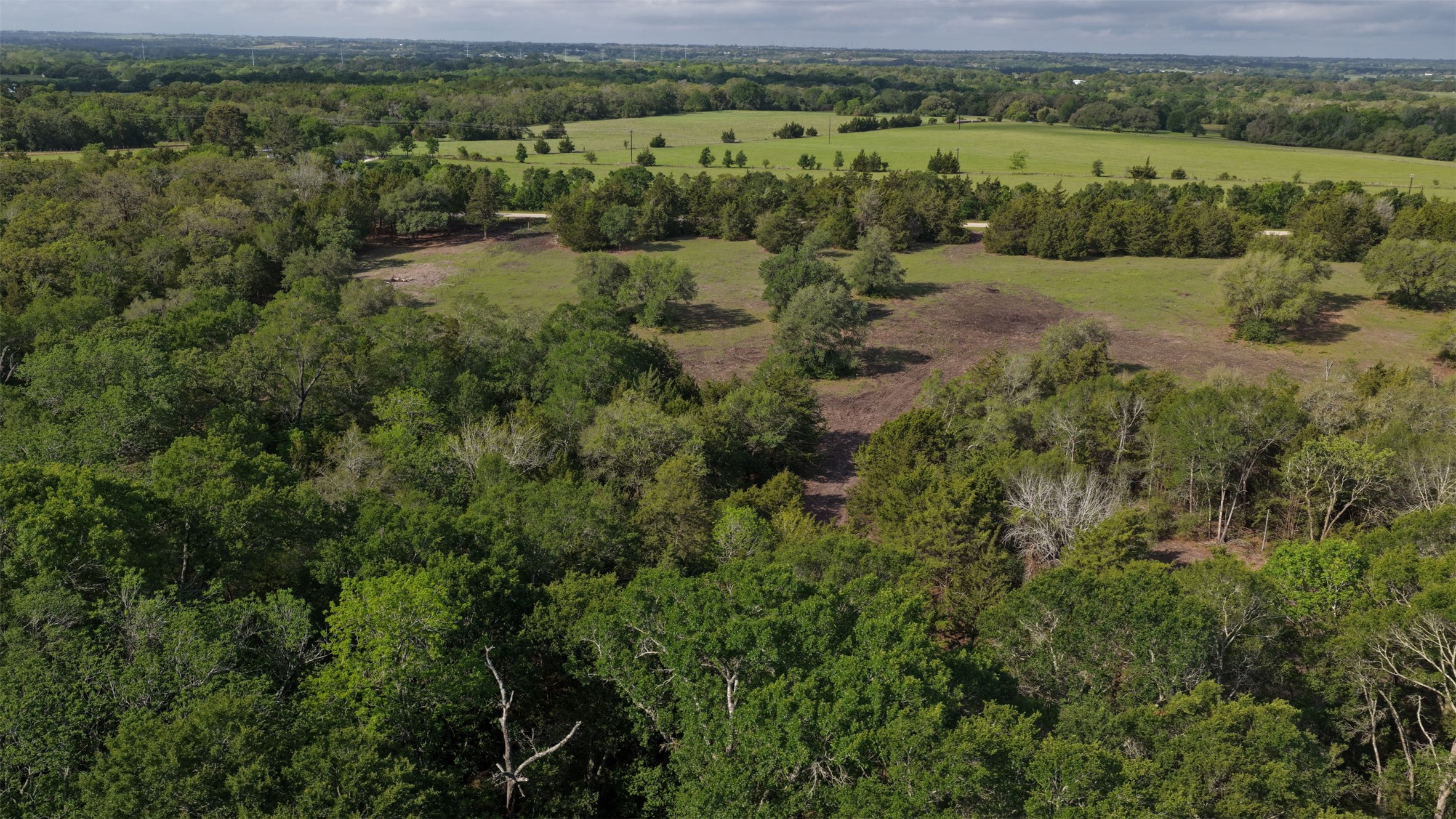 7 Baranowski Road Brenham, TX 77833 - Photo 2 of 5 an aerial view of residential house with outdoor space and trees all around