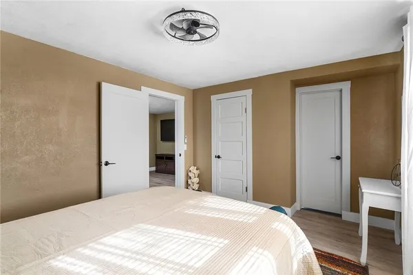 a bedroom with a bed and a table in it