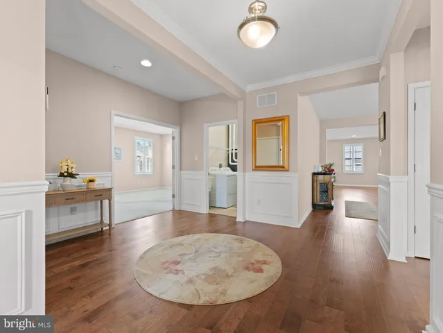 a view of a livingroom with furniture and wooden floor