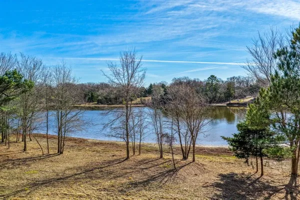 a view of a backyard of the house
