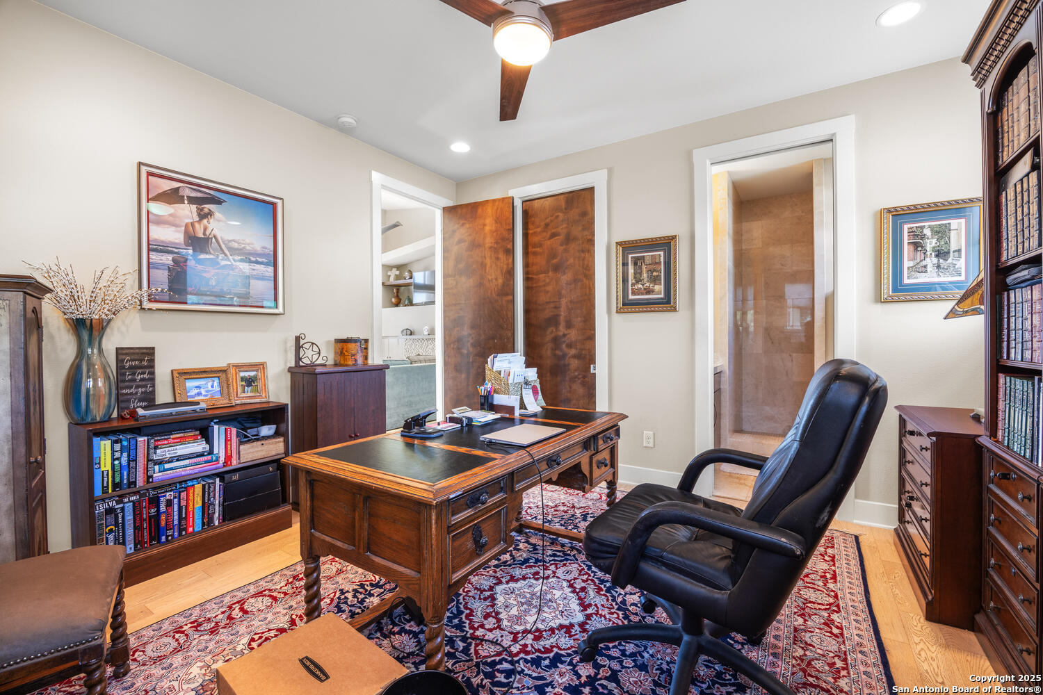 1758 Lincoln Smith Road Round Mountain, TX 78663 - Photo 28 of 50 a living room with furniture a bookshelf and a window