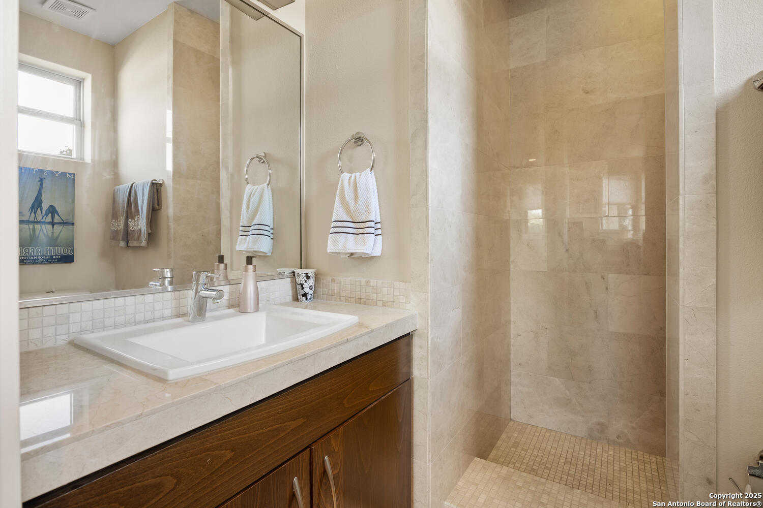 1758 Lincoln Smith Road Round Mountain, TX 78663 - Photo 29 of 50 a bathroom with a sink and a mirror