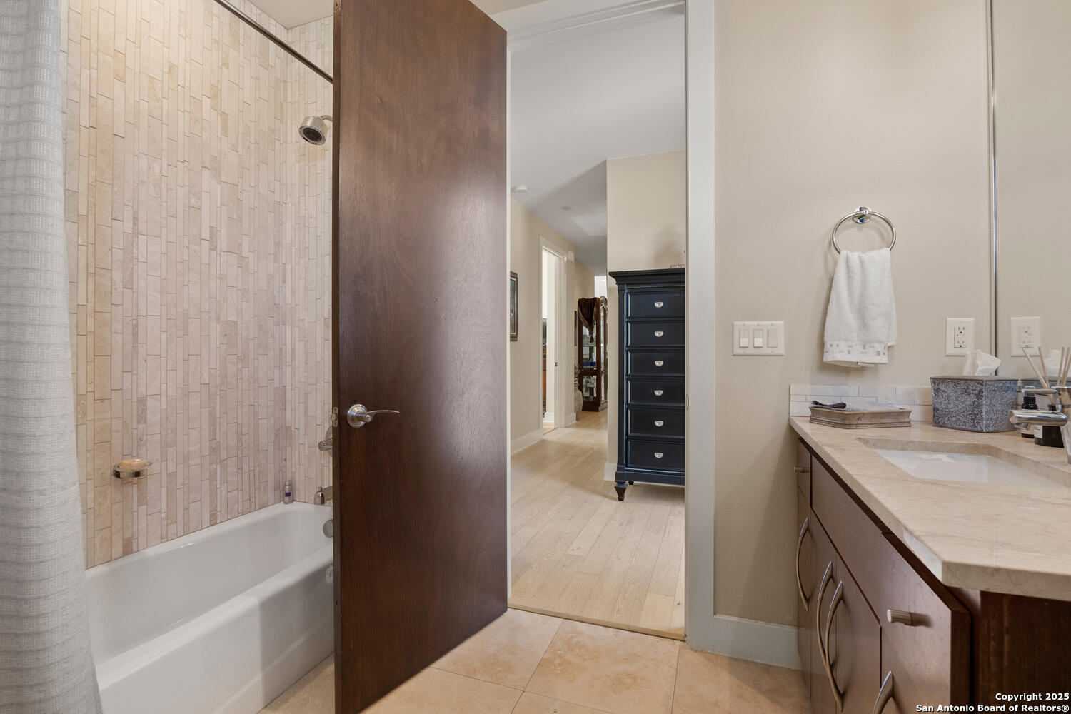 1758 Lincoln Smith Road Round Mountain, TX 78663 - Photo 36 of 50 a bathroom with a granite countertop sink and a bathtub