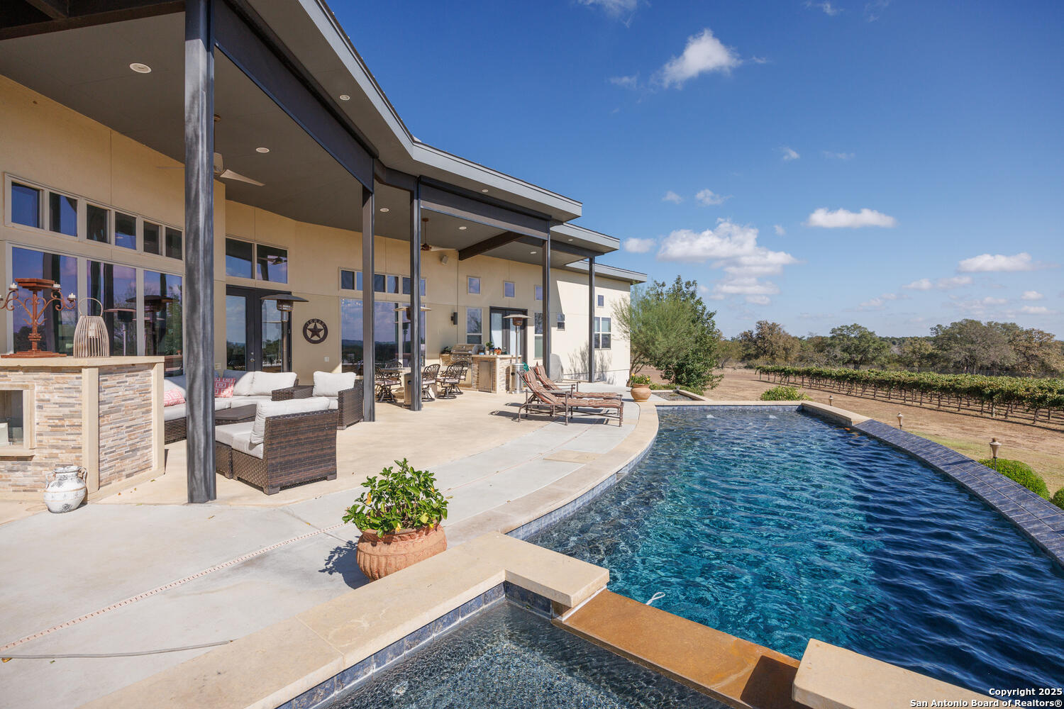 1758 Lincoln Smith Road Round Mountain, TX 78663 - Photo 39 of 50 a view of swimming pool with outdoor seating and plants