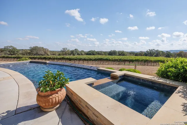 a view of a swimming pool and lounge chair