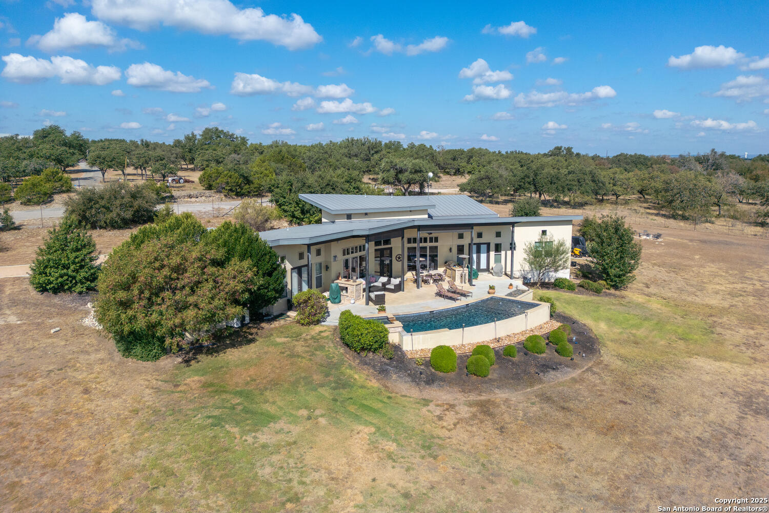 1758 Lincoln Smith Road Round Mountain, TX 78663 - Photo 44 of 50 a view of a house with a yard balcony and ocean view