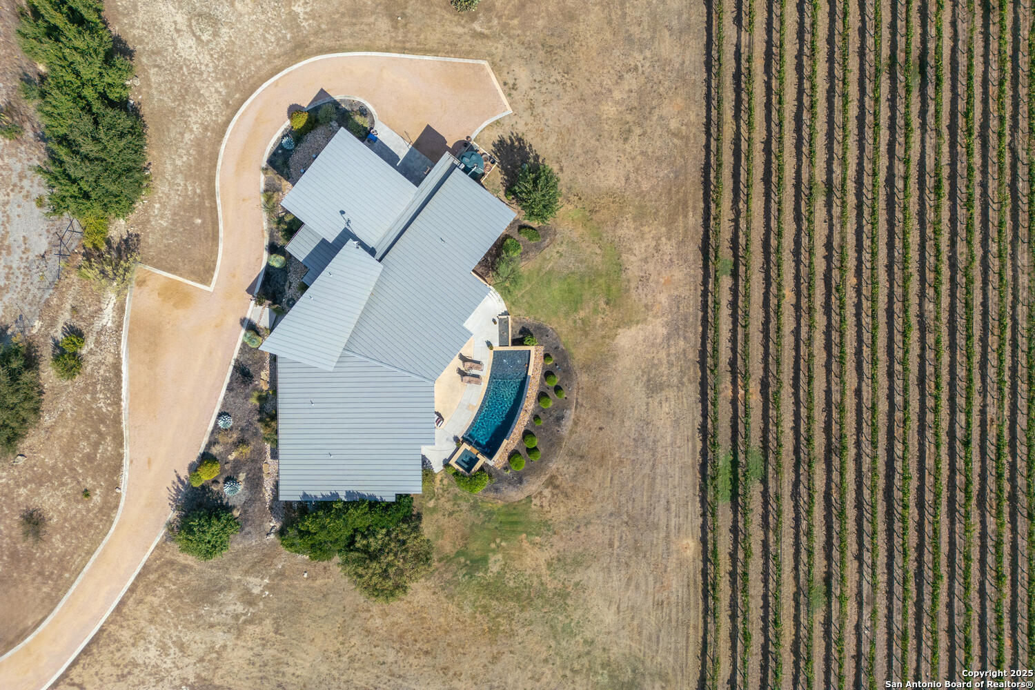 1758 Lincoln Smith Road Round Mountain, TX 78663 - Photo 50 of 50 an aerial view of a house with a backyard space