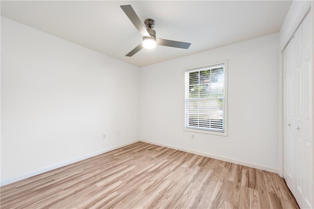 125 Pine Ridge Trace Athens, GA 30605 - Photo 19 of 28 wooden floor in an empty room with a window