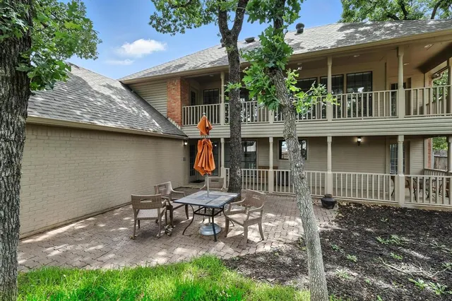 a house with table and chairs in front of it