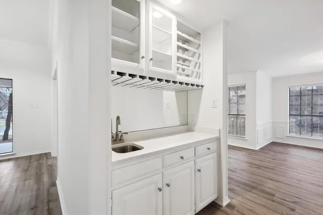 a kitchen with stainless steel appliances a sink and cabinets