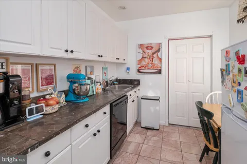 a kitchen with stainless steel appliances and cabinets