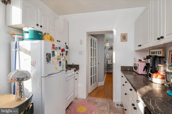 a kitchen with a refrigerator a sink and dishwasher