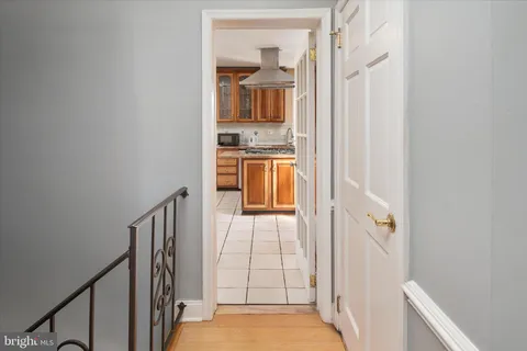 a view of a hallway with a dining room