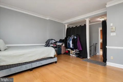 a bed room with a bed and gym equipment