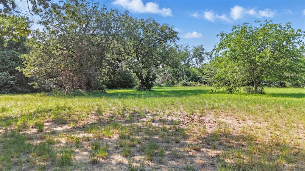 Tbd4 West Shady Shores Road Shady Shores, TX 76208 - Photo 4 of 6 a view of a lake with a yard
