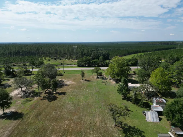 an aerial view of a houses with outdoor space