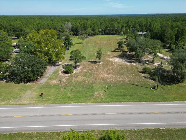 a view of a lake with a yard
