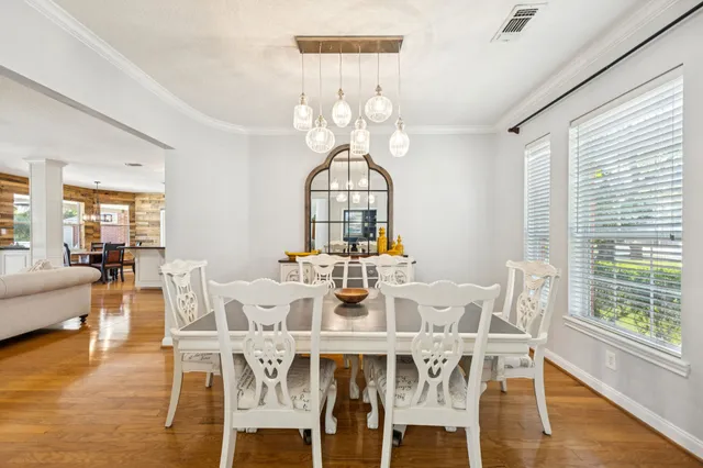 a view of a dining room with furniture window and wooden floor