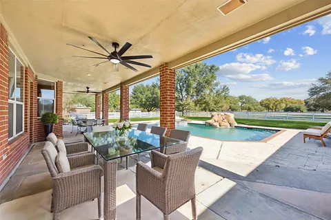 a view of a backyard with large tree