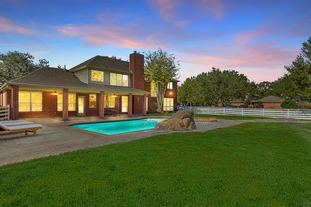a picture of a bathroom with a bathtub