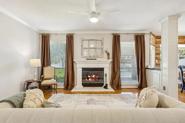a living room with furniture and a fireplace